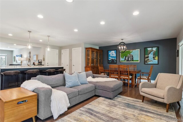 3040 S Dexter Way, Denver, CO 80222 - living room featuring a chandelier, recessed lighting, and wood finished floors