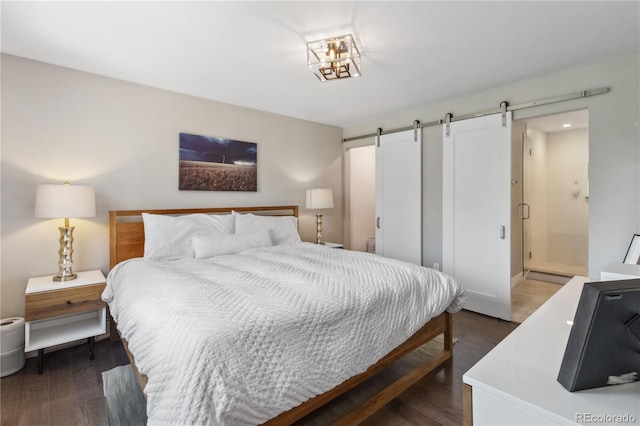 3040 S Dexter Way, Denver, CO 80222 - bedroom with a barn door, dark wood finished floors, and baseboards