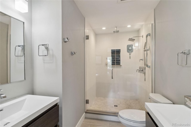 3040 S Dexter Way, Denver, CO 80222 - full bathroom with toilet, vanity, a stall shower, tile patterned flooring, and recessed lighting