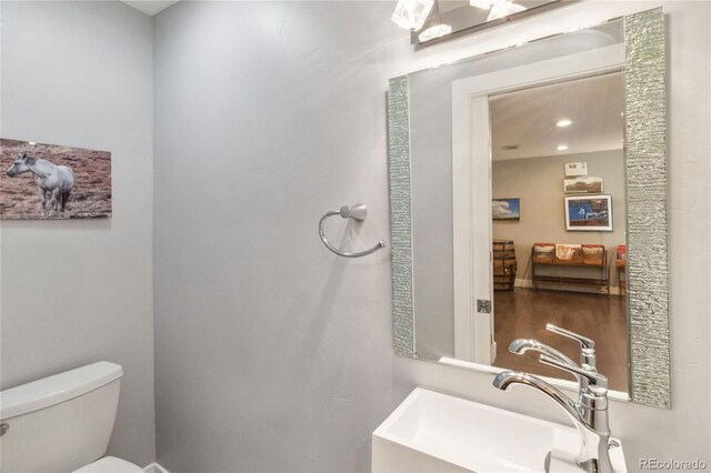 3040 S Dexter Way, Denver, CO 80222 - bathroom featuring a sink and toilet