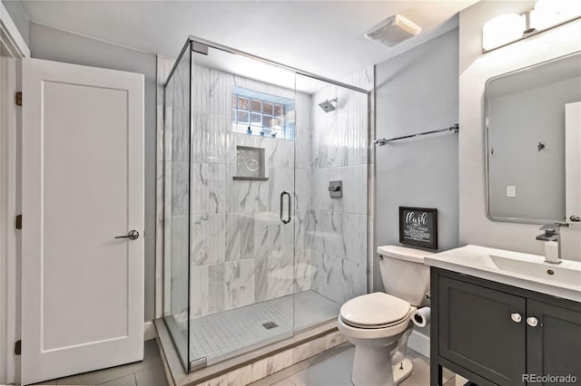 3040 S Dexter Way, Denver, CO 80222 - bathroom with a shower stall, toilet, tile patterned floors, and vanity