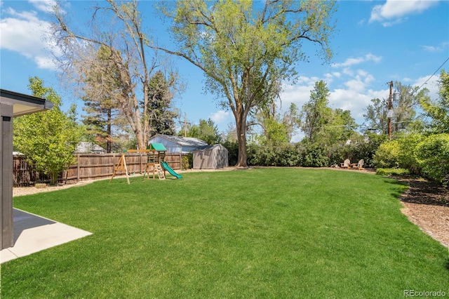 3040 S Dexter Way, Denver, CO 80222 - view of yard with a shed, a playground, and an outbuilding