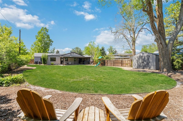 3040 S Dexter Way, Denver, CO 80222 - view of yard featuring a shed, an outdoor structure, and a playground