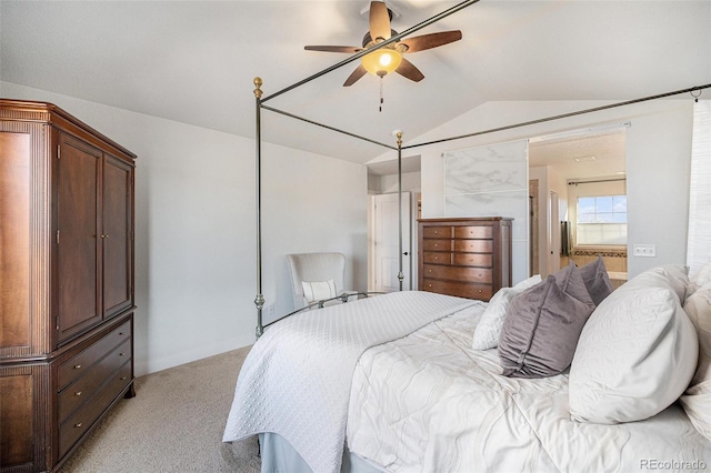 bedroom with light carpet, lofted ceiling, and a ceiling fan