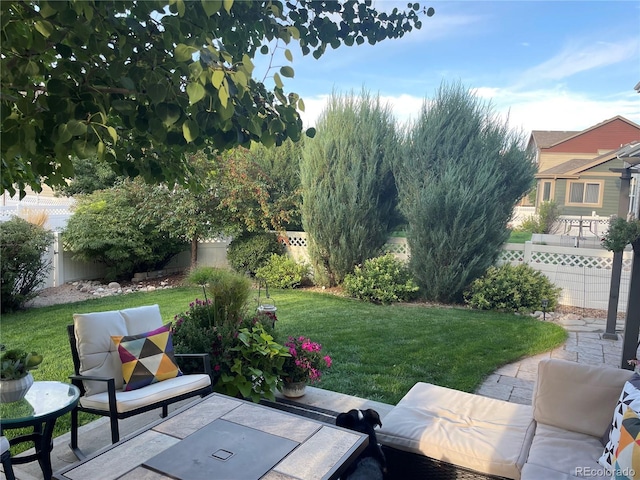 view of yard featuring an outdoor hangout area, a patio area, and a fenced backyard