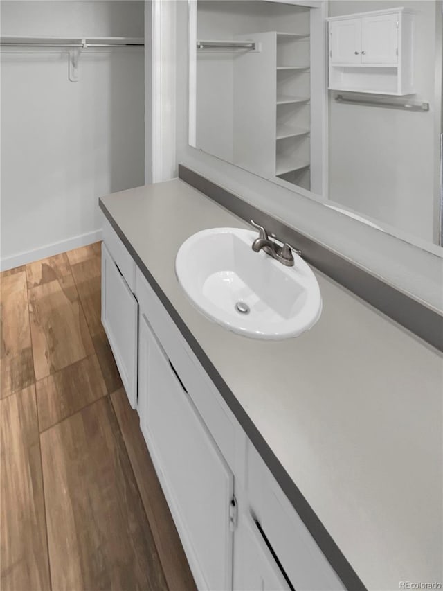 bathroom with wood-type flooring and vanity