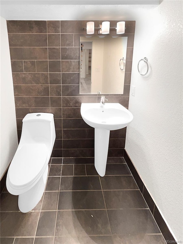 bathroom with tile patterned floors and toilet