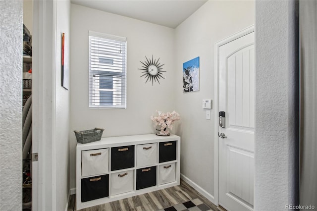 interior space with baseboards and light wood-style flooring