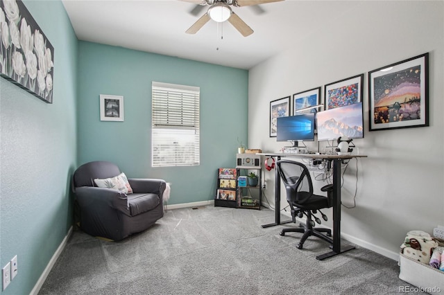 office area featuring carpet floors, baseboards, and ceiling fan