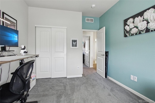 carpeted office with baseboards and visible vents