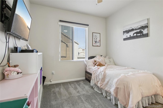 carpeted bedroom featuring baseboards