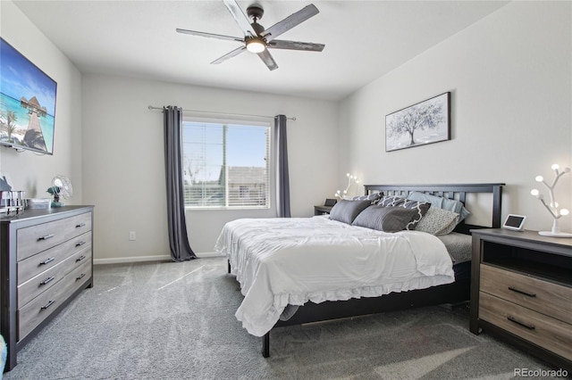 carpeted bedroom featuring baseboards and ceiling fan