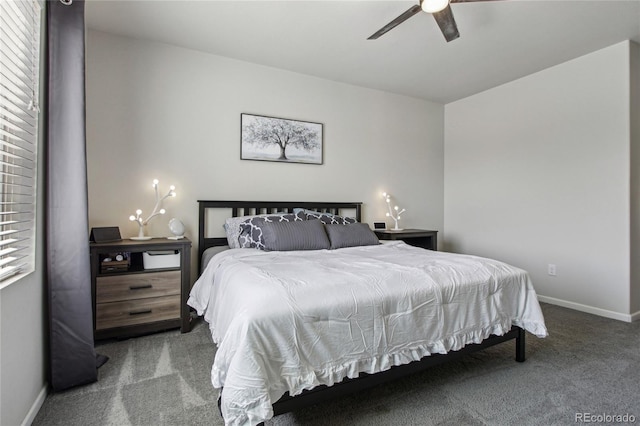 carpeted bedroom featuring baseboards and ceiling fan