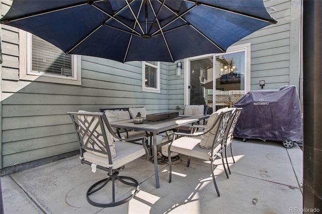 view of patio featuring outdoor dining area and grilling area