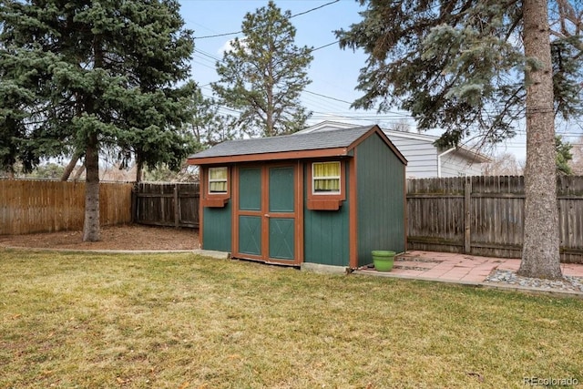 view of shed featuring a fenced backyard