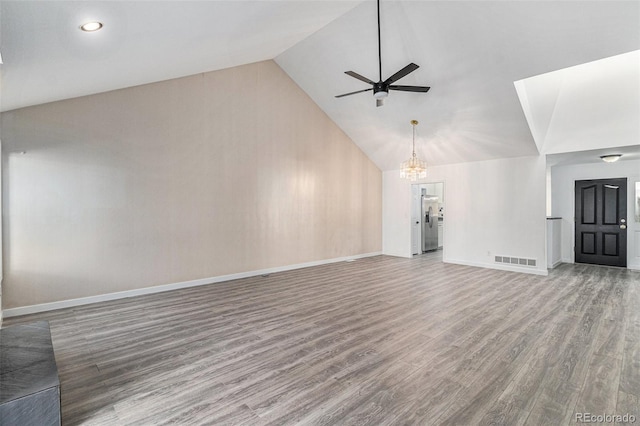 10000 E Yale Ave Unit 58, Denver, CO 80231 - unfurnished living room featuring wood finished floors, ceiling fan, high vaulted ceiling, and a chandelier