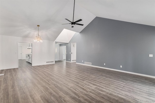 10000 E Yale Ave Unit 58, Denver, CO 80231 - unfurnished living room featuring a ceiling fan, high vaulted ceiling, wood finished floors, and a chandelier