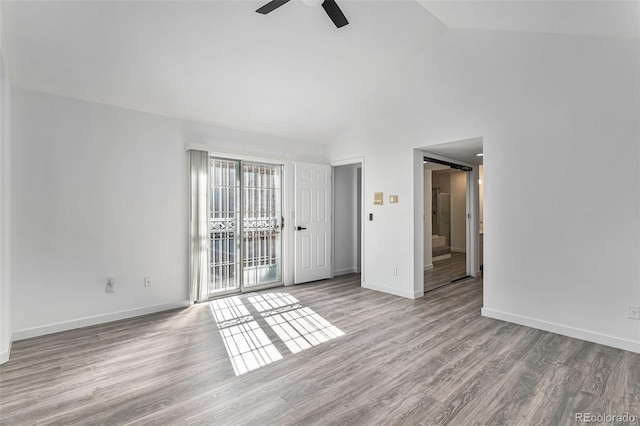 10000 E Yale Ave Unit 58, Denver, CO 80231 - empty room featuring ceiling fan, lofted ceiling, and wood finished floors