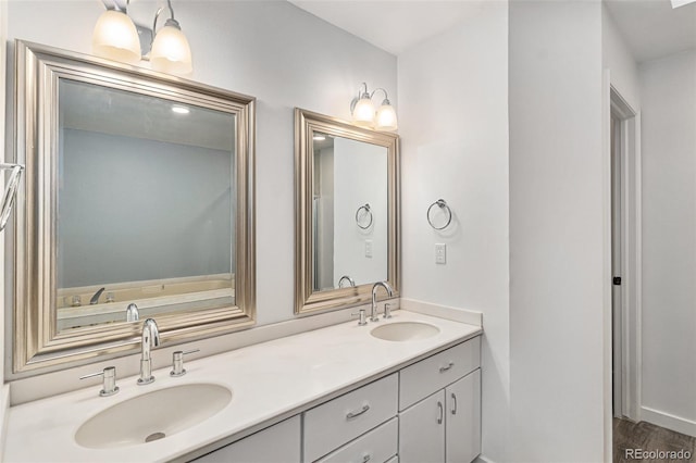 10000 E Yale Ave Unit 58, Denver, CO 80231 - full bath featuring double vanity and wood finished floors