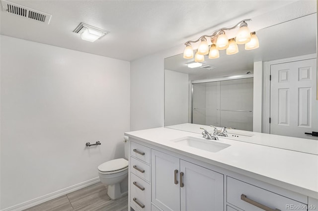 10000 E Yale Ave Unit 58, Denver, CO 80231 - full bathroom with vanity, a shower with shower door, and wood finished floors