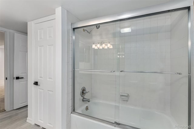 10000 E Yale Ave Unit 58, Denver, CO 80231 - full bath with combined bath / shower with glass door and wood finished floors