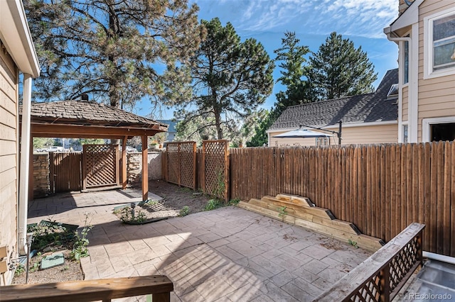 10000 E Yale Ave Unit 58, Denver, CO 80231 - fenced backyard featuring a gate and a patio area