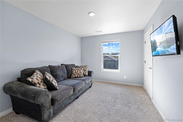 living area with carpet floors and baseboards