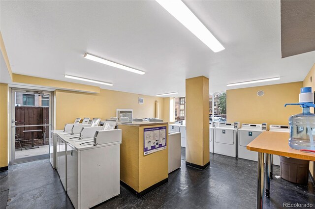 clothes washing area featuring washer and dryer