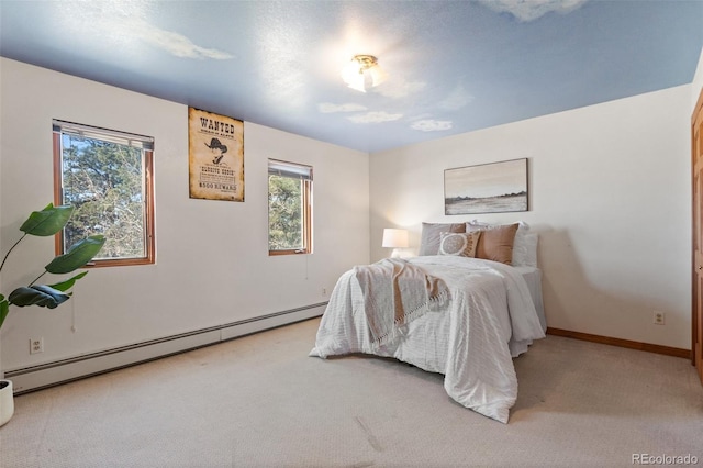 bedroom with carpet flooring and a baseboard radiator