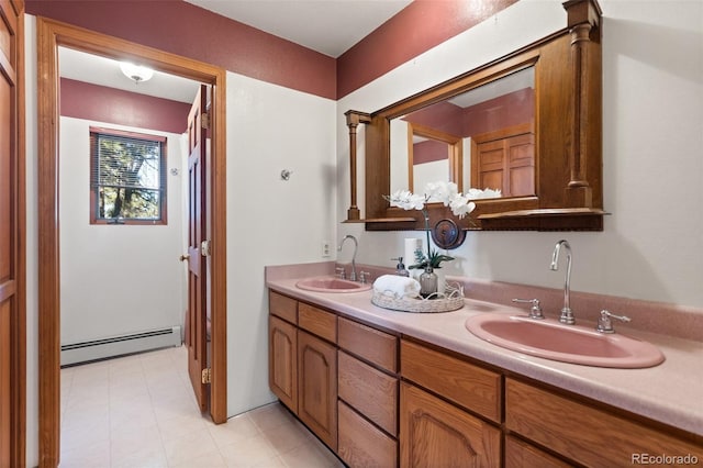 bathroom with vanity and a baseboard heating unit