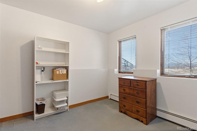 miscellaneous room with a baseboard radiator and light colored carpet