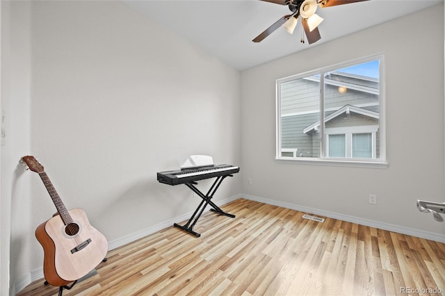 miscellaneous room featuring baseboards, visible vents, a ceiling fan, and wood finished floors