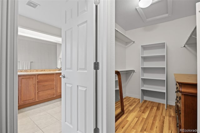 spacious closet with attic access and visible vents