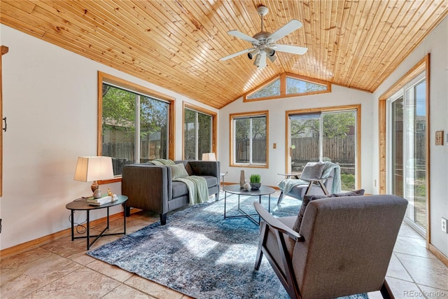 living room featuring wood ceiling, lofted ceiling, a ceiling fan, and baseboards