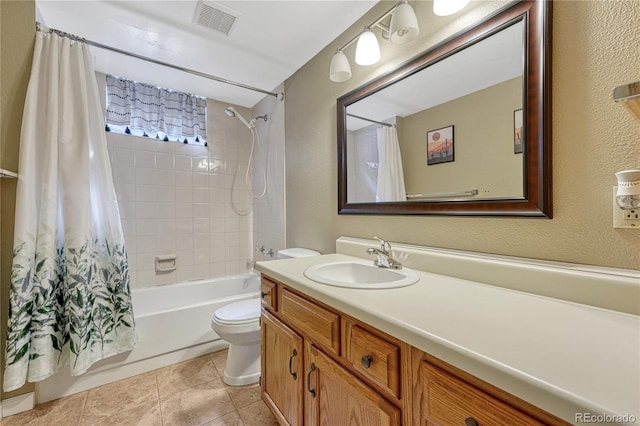full bathroom with toilet, vanity, a textured wall, and shower / tub combo with curtain