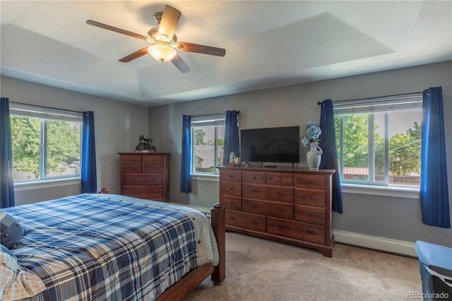 10640 W 46th Ave, Wheat Ridge, CO 80033 - carpeted bedroom with baseboard heating, multiple windows, ceiling fan, and baseboards