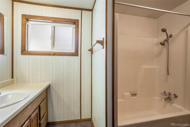 8333 Mummy Range Dr, Fort Collins, CO 80528 - full bath with vanity, wallpapered walls, and washtub / shower combination