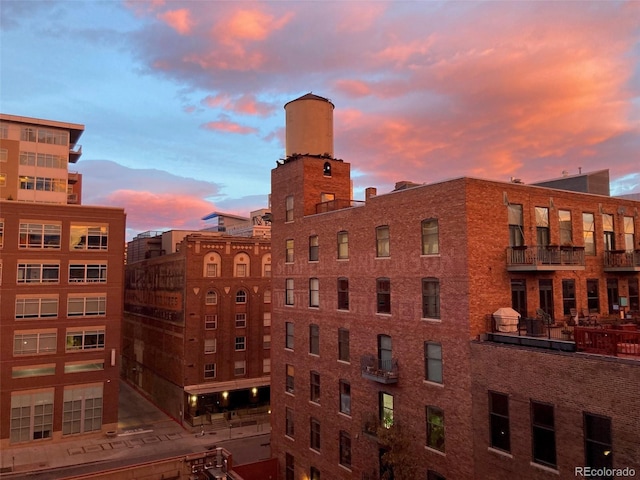 view of outdoor building at dusk