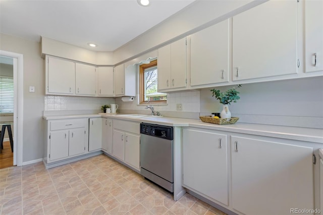 kitchen with dishwasher, a sink, light countertops, decorative backsplash, and recessed lighting