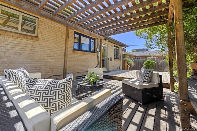 view of patio featuring an outdoor living space, fence, a pergola, and a deck