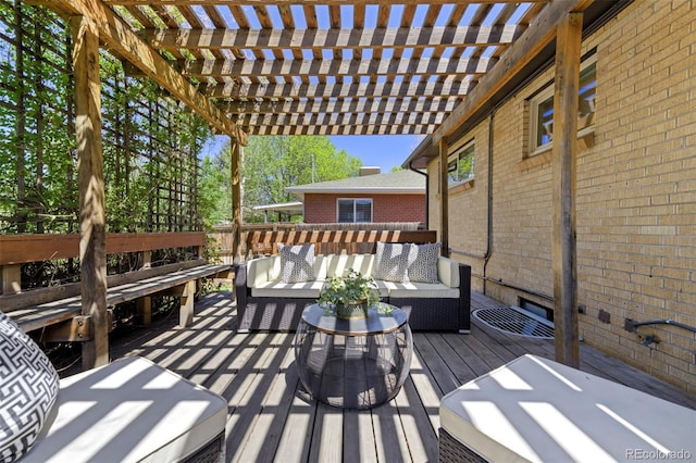 wooden terrace featuring an outdoor living space and a pergola