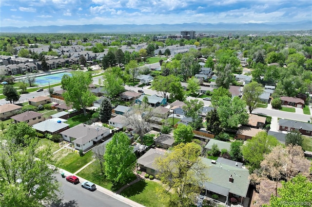 aerial perspective of suburban area featuring a mountain backdrop