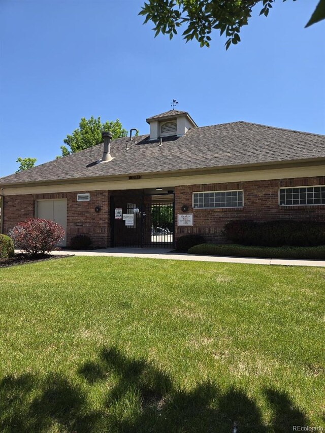 12742 Clermont St, Thornton, CO 80241 - view of front facade featuring a front yard and brick siding