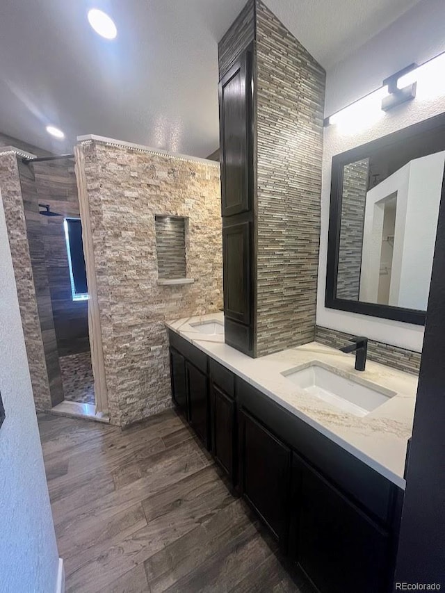 12742 Clermont St, Thornton, CO 80241 - full bathroom with double vanity, walk in shower, and wood finished floors