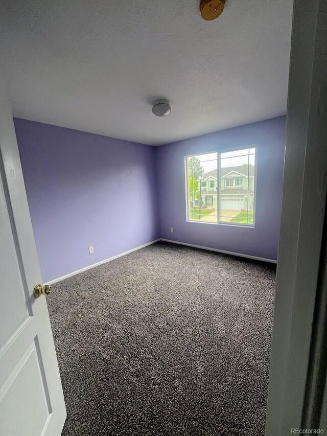 12742 Clermont St, Thornton, CO 80241 - carpeted spare room featuring baseboards