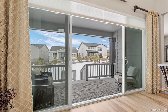 doorway to outside with hardwood / wood-style floors