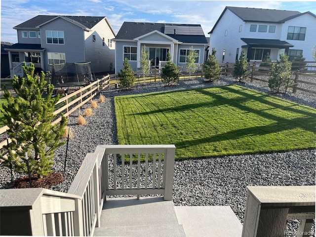 view of yard with a trampoline