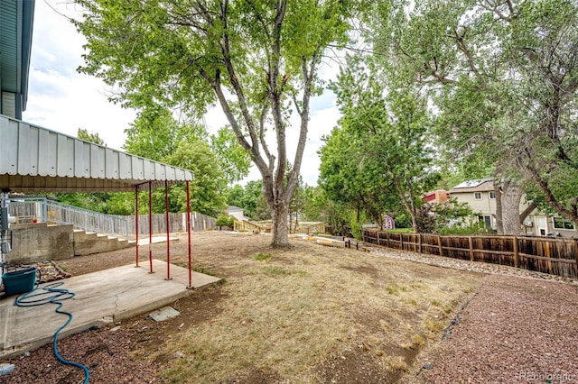 view of yard featuring a fenced backyard and a patio