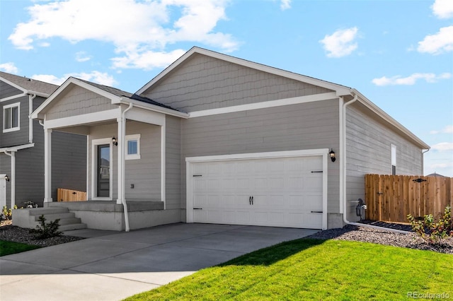 7326 Green River Ave, Frederick, CO 80530 - view of front of home with an attached garage, driveway, and fence