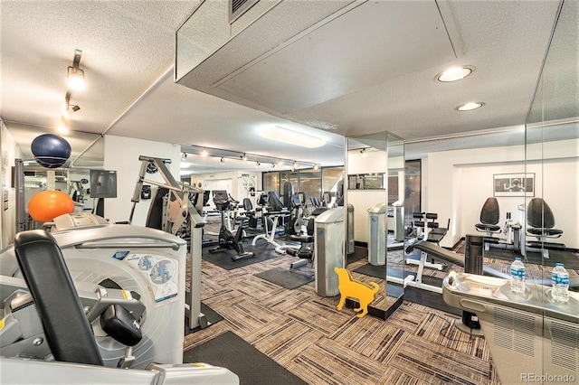 workout area with carpet flooring and a textured ceiling